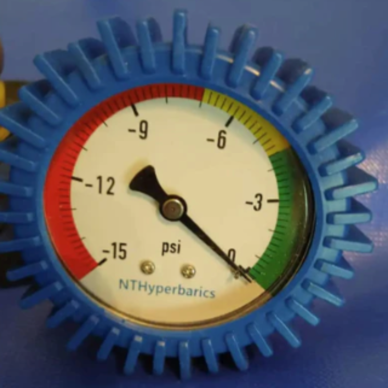 White hyperbaric chamber for home, office, and clinical use with visible view ports, valves, and a compressor, branded by Newtowne Hyperbarics.